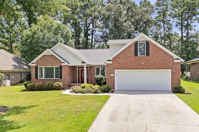 view of front of property featuring a front lawn and a garage