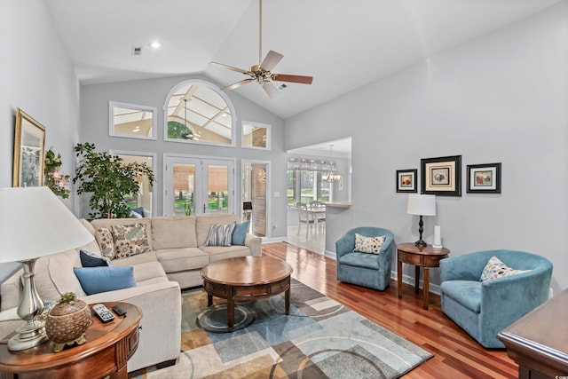 living room with french doors, high vaulted ceiling, hardwood / wood-style flooring, and ceiling fan