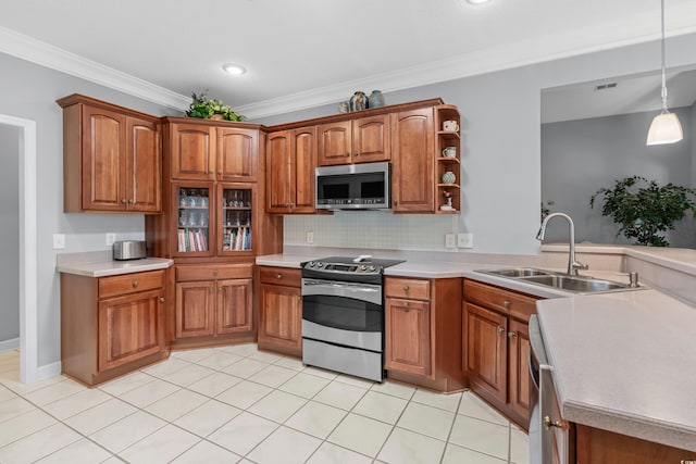 kitchen featuring hanging light fixtures, crown molding, appliances with stainless steel finishes, sink, and light tile patterned flooring