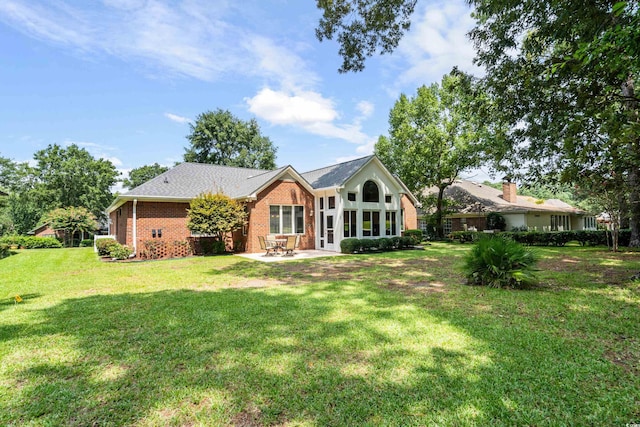 ranch-style house featuring a patio area and a front yard