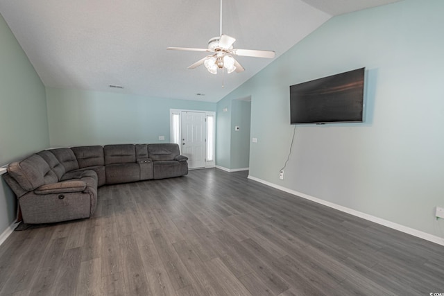 living room featuring lofted ceiling, dark wood-type flooring, and ceiling fan