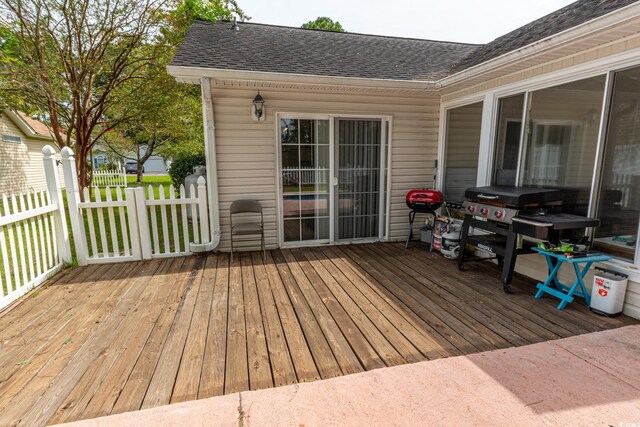 deck featuring a grill