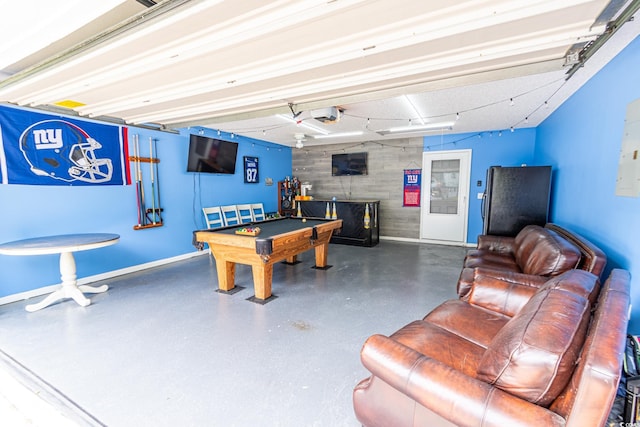 playroom featuring wooden walls, pool table, an accent wall, and baseboards