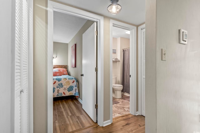 hall featuring wood finished floors