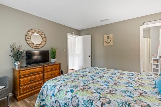 bedroom featuring hardwood / wood-style flooring