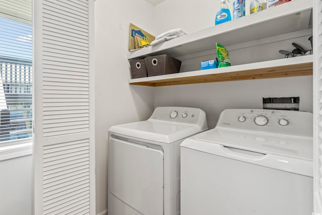 laundry room with laundry area and washing machine and clothes dryer