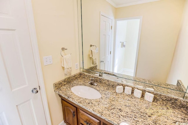 bathroom featuring vanity and crown molding