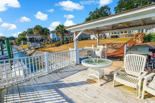 wooden deck featuring ceiling fan