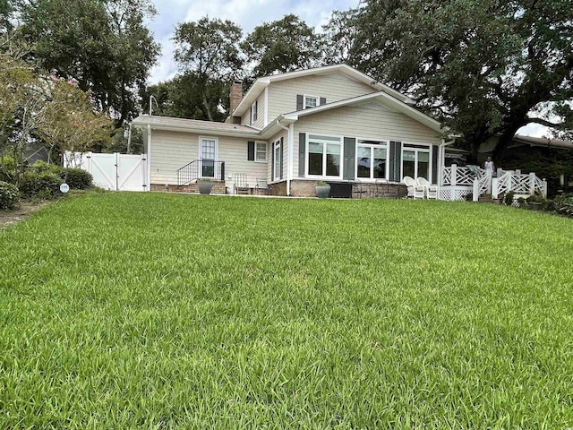 dock area featuring a lawn, a gazebo, and a water view