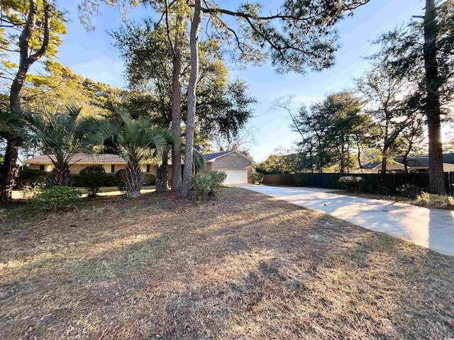 902 N 11th Ave N, North Myrtle Beach, SC 29582 - view of yard featuring fence and driveway