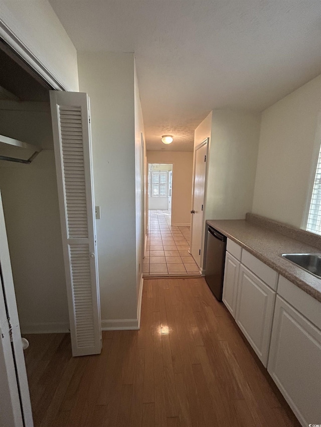 902 N 11th Ave N, North Myrtle Beach, SC 29582 - corridor with a sink, baseboards, and wood finished floors