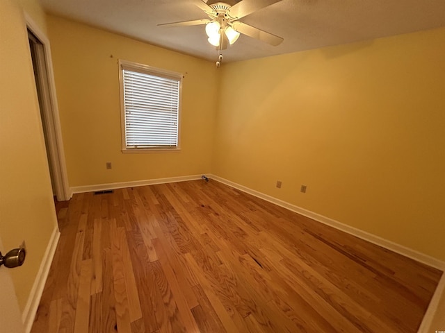 unfurnished room featuring ceiling fan and light wood-type flooring