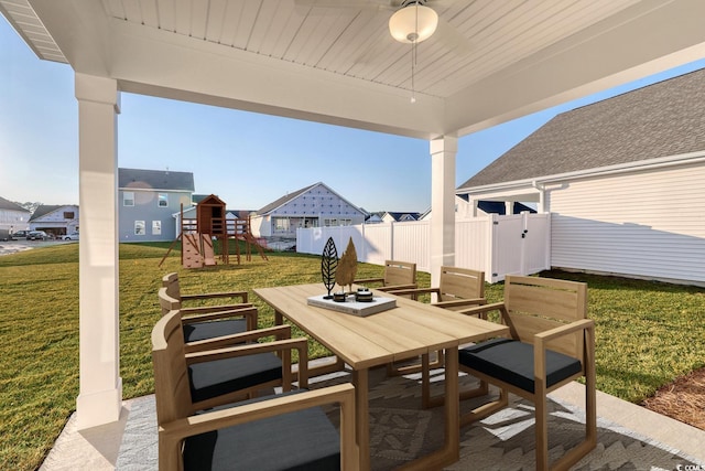 view of patio / terrace featuring a playground and ceiling fan