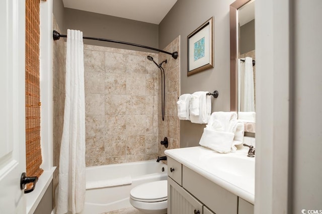 bathroom with vanity, toilet, and shower / bathtub combination with curtain