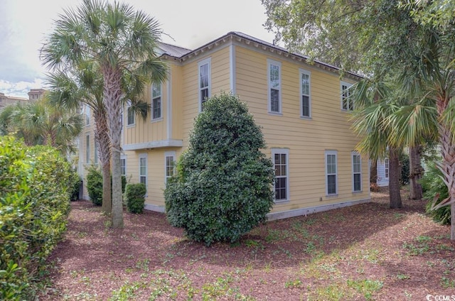 view of side of property featuring metal roof