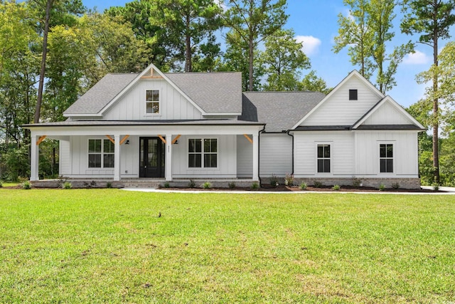 modern inspired farmhouse with covered porch and a front lawn