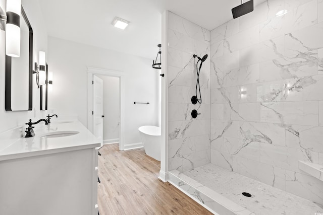 bathroom with vanity, plus walk in shower, and hardwood / wood-style floors