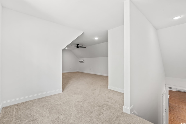 bonus room with ceiling fan, light colored carpet, and lofted ceiling