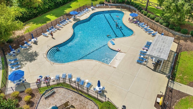 view of swimming pool with a patio