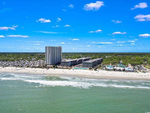 drone / aerial view featuring a view of the beach and a water view