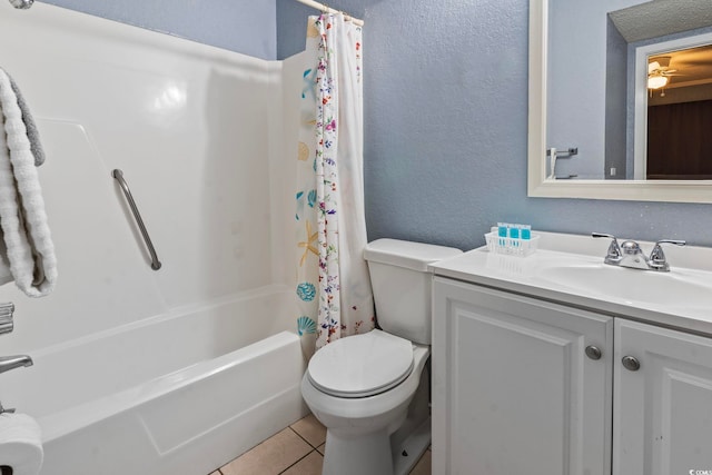 full bathroom featuring tile patterned flooring, vanity, toilet, and shower / bath combo with shower curtain