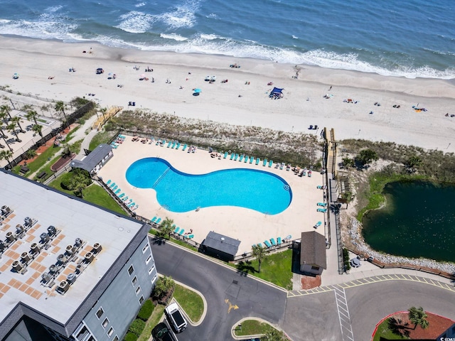 bird's eye view featuring a water view and a view of the beach