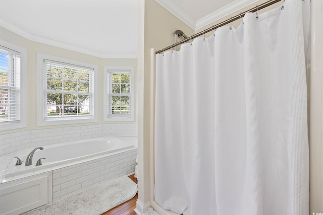 bathroom featuring shower with separate bathtub, ornamental molding, and hardwood / wood-style floors