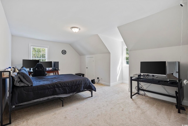 carpeted bedroom with vaulted ceiling