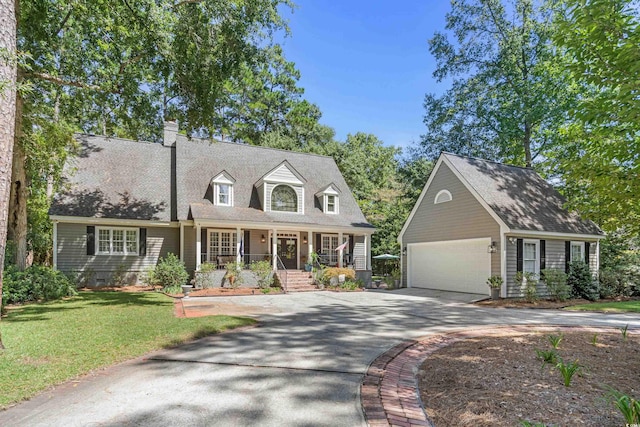 cape cod home featuring an outbuilding, a front yard, a porch, and a garage