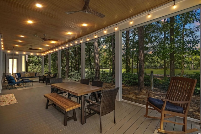 sunroom / solarium with ceiling fan and wooden ceiling