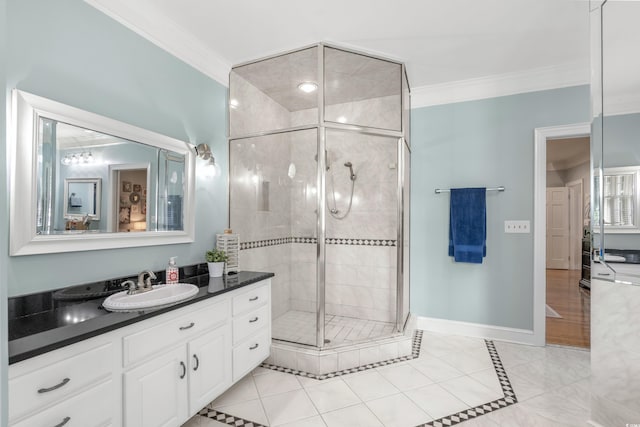 bathroom featuring tile patterned flooring, vanity, an enclosed shower, and crown molding