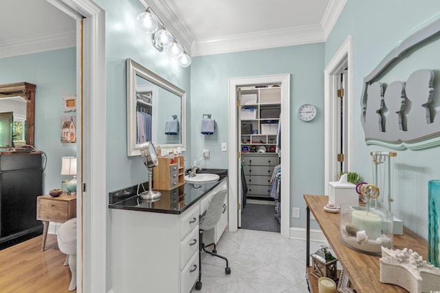 bathroom featuring vanity and ornamental molding