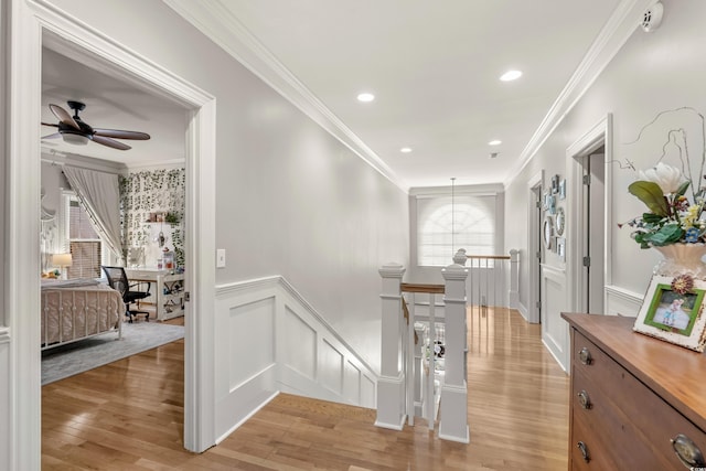 corridor featuring light hardwood / wood-style floors and ornamental molding