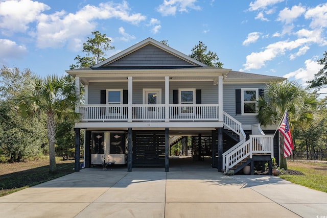 coastal inspired home with a porch and a carport