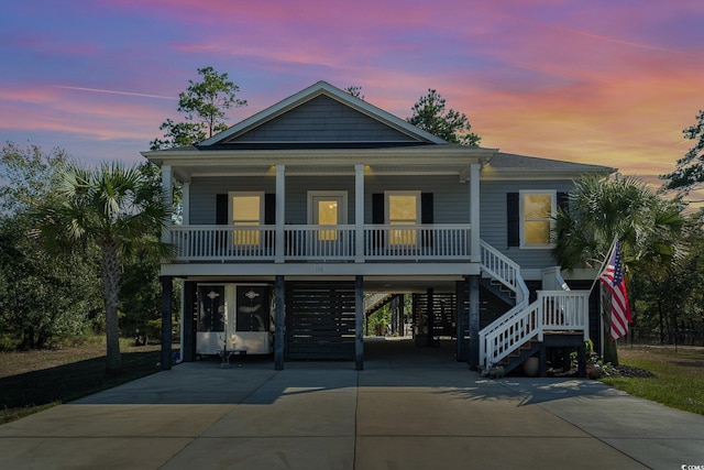 beach home featuring a carport and covered porch