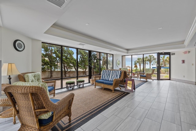 living room featuring a tray ceiling