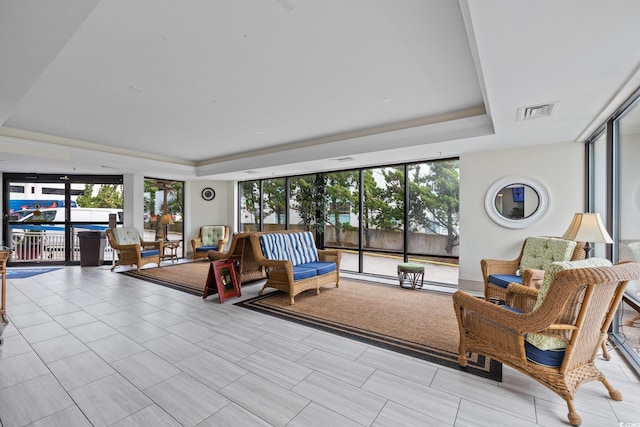 living room featuring a raised ceiling