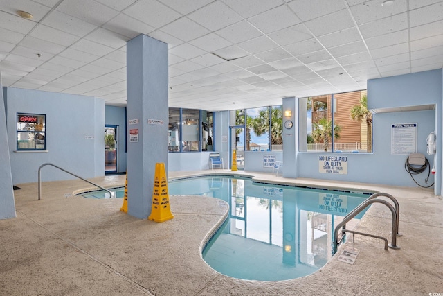 view of swimming pool with a jacuzzi