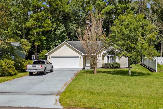 view of front of house with a front yard and a garage