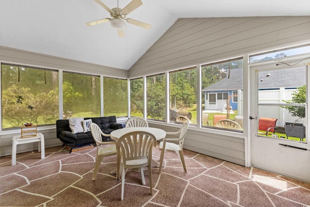 sunroom / solarium with ceiling fan and lofted ceiling