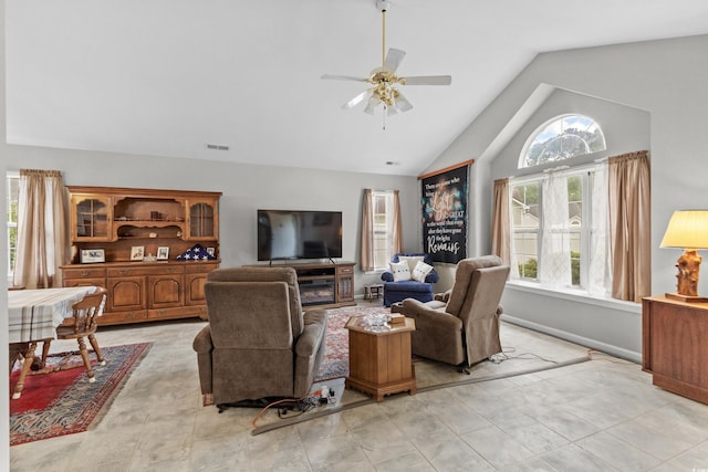 living room with ceiling fan and lofted ceiling