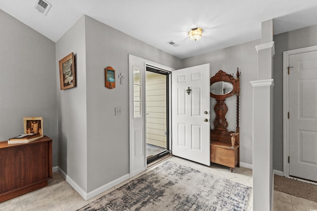 foyer entrance featuring light tile patterned floors