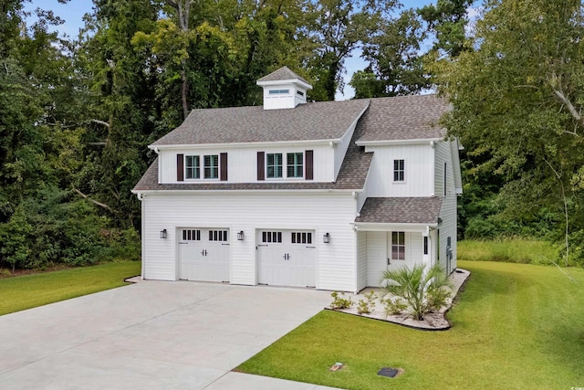 view of front of house featuring a garage and a front yard