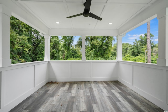 unfurnished sunroom featuring ceiling fan