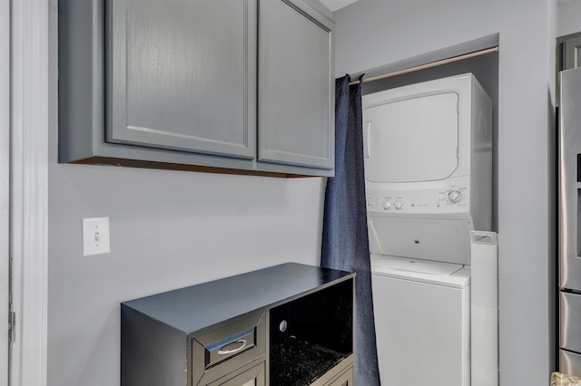 laundry room featuring stacked washing maching and dryer