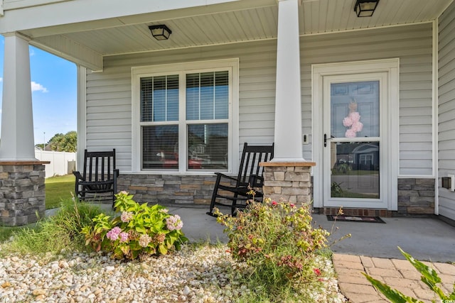 view of exterior entry featuring a porch