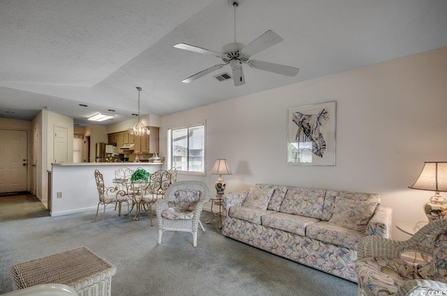 carpeted living room with a textured ceiling, ceiling fan with notable chandelier, and lofted ceiling