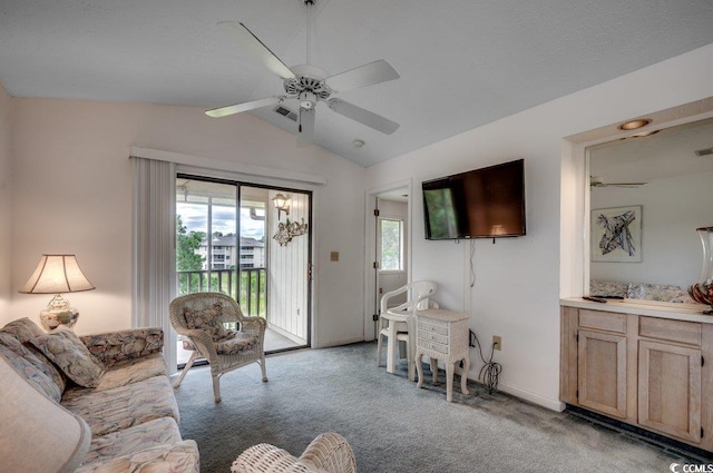 living room with vaulted ceiling, light carpet, and ceiling fan