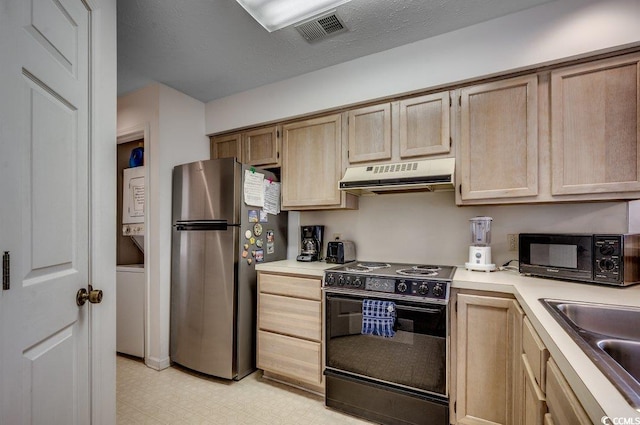 kitchen featuring stacked washer and dryer, a textured ceiling, sink, black appliances, and light brown cabinetry