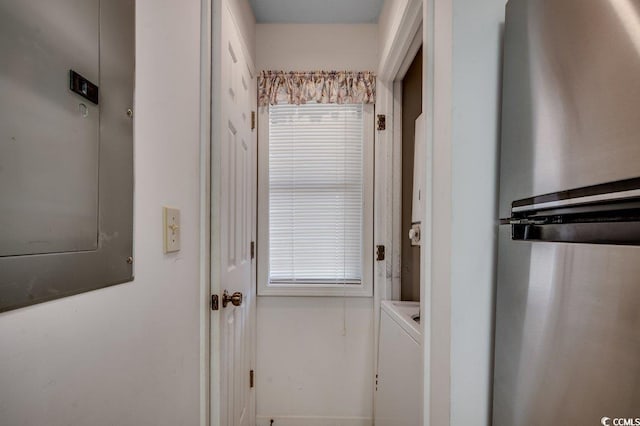 entryway featuring electric panel and washer / dryer